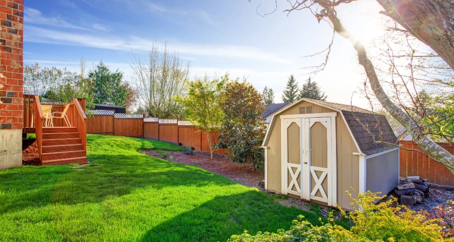 Fenced backyard with storage shed in Monroe